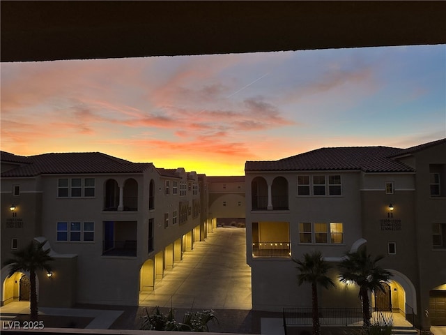 view of outdoor building at dusk