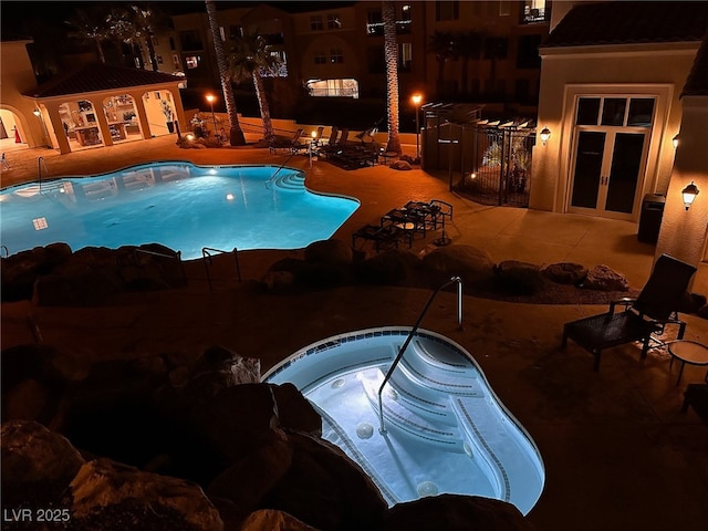 view of pool with a patio area and an outdoor structure