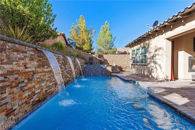 view of pool featuring a patio and pool water feature