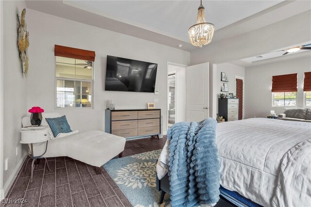 bedroom featuring a notable chandelier and dark hardwood / wood-style floors