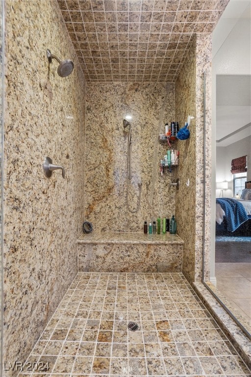 bathroom with tiled shower