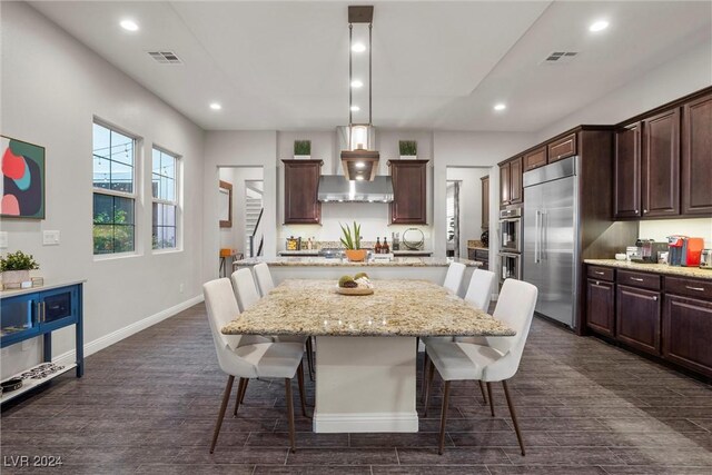 dining room with dark hardwood / wood-style flooring