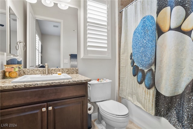 full bathroom with vanity, toilet, and shower / bath combination with curtain