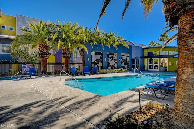 view of swimming pool with a patio