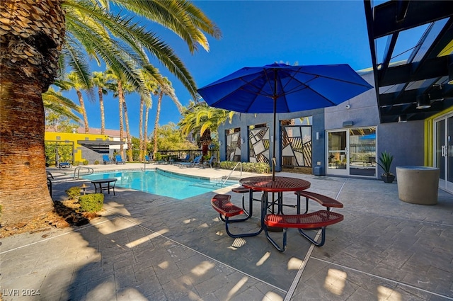 view of swimming pool featuring a patio