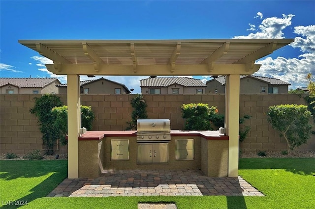 view of patio with a grill, area for grilling, and a pergola