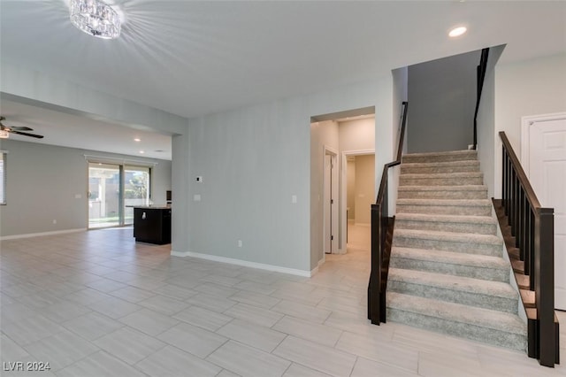 stairs with ceiling fan