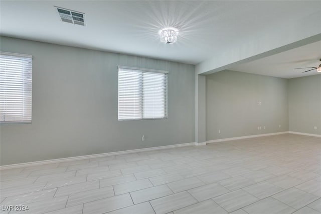 empty room featuring ceiling fan