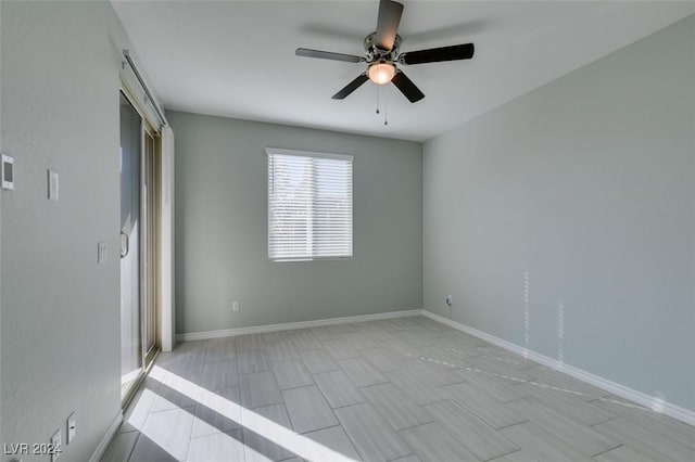 spare room featuring ceiling fan