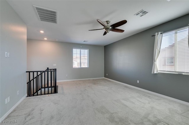 carpeted empty room with ceiling fan