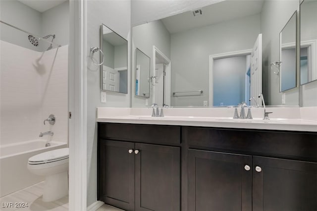 full bathroom with toilet, vanity, tile patterned floors, and shower / tub combination