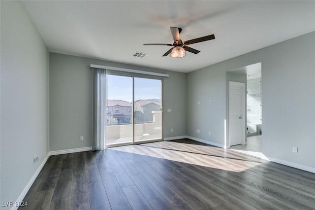 empty room featuring ceiling fan and dark hardwood / wood-style floors