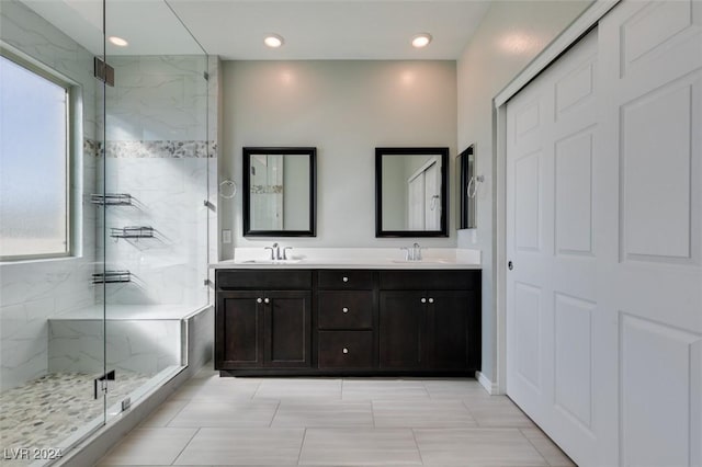 bathroom with an enclosed shower and vanity