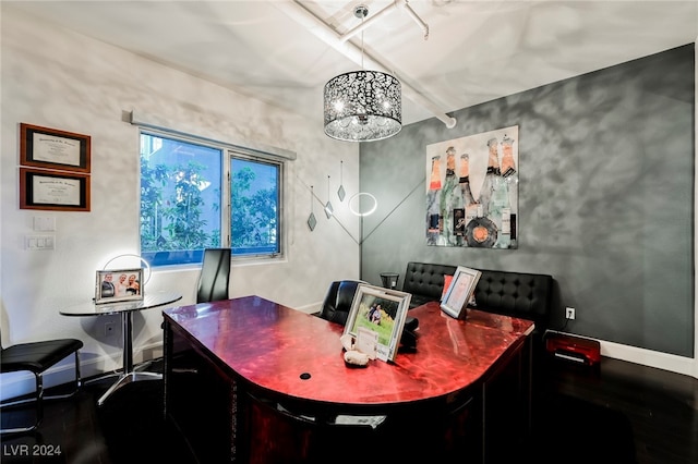 office area with an inviting chandelier and hardwood / wood-style floors