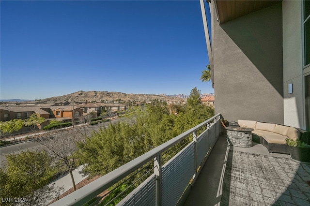 balcony with a mountain view and outdoor lounge area