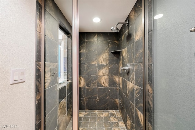 bathroom with a tile shower