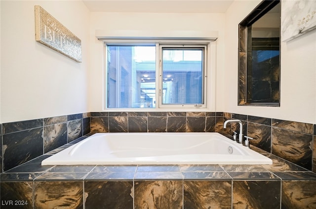 bathroom with tiled tub