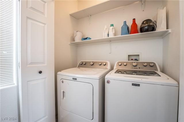 washroom featuring washing machine and dryer