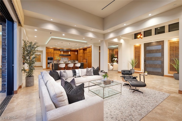 living room with a towering ceiling