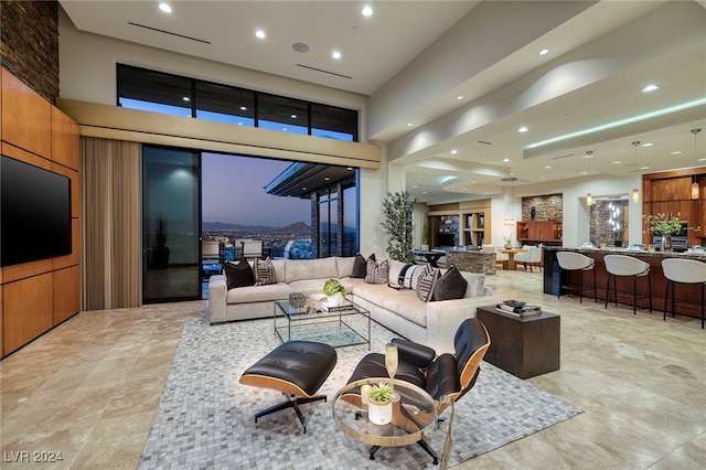 living room featuring a high ceiling