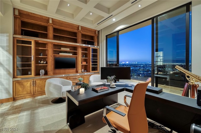 office area featuring built in desk, beamed ceiling, and coffered ceiling