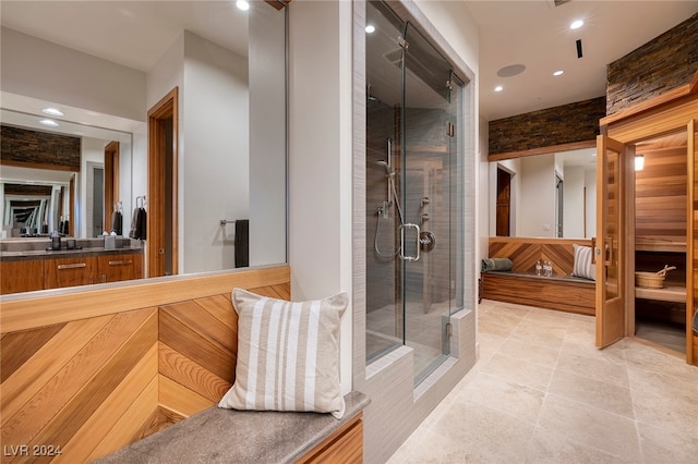 bathroom featuring vanity, tile patterned floors, and an enclosed shower