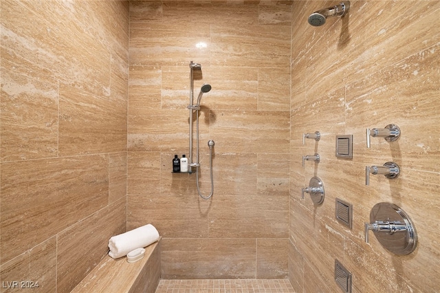 bathroom with tiled shower