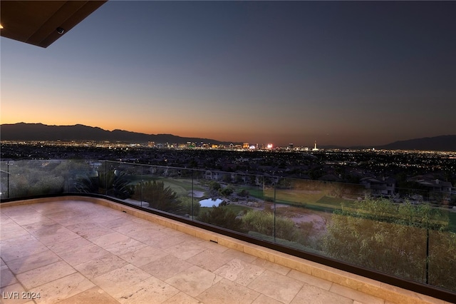 patio terrace at dusk with a mountain view