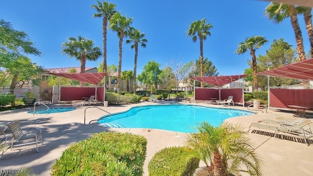 view of swimming pool with a patio