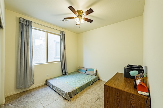 bedroom featuring light tile patterned flooring and ceiling fan