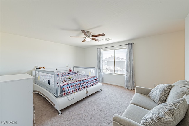 carpeted bedroom with ceiling fan