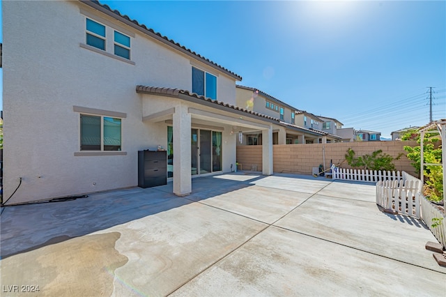 back of property with a patio area