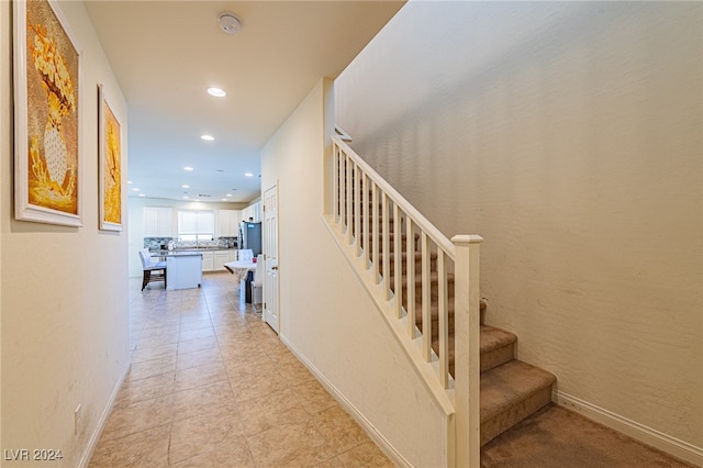 stairs with tile patterned floors