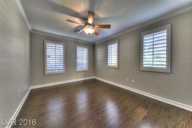 empty room with crown molding, ceiling fan, and dark hardwood / wood-style flooring