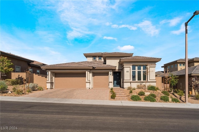 prairie-style house featuring a garage