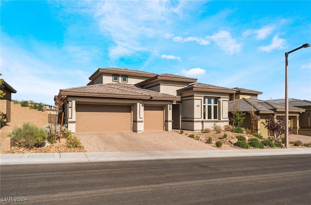 prairie-style home featuring a garage