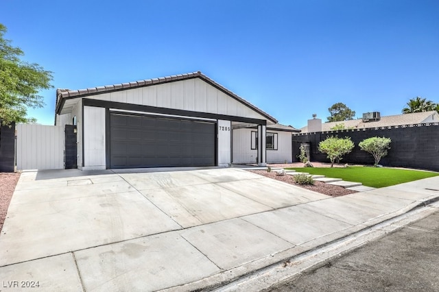 ranch-style house with a front lawn and a garage