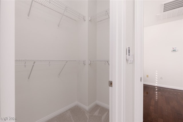 spacious closet featuring hardwood / wood-style floors