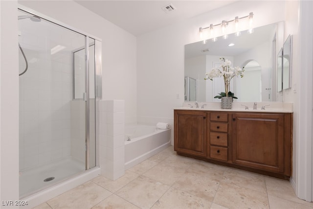 bathroom featuring vanity and separate shower and tub