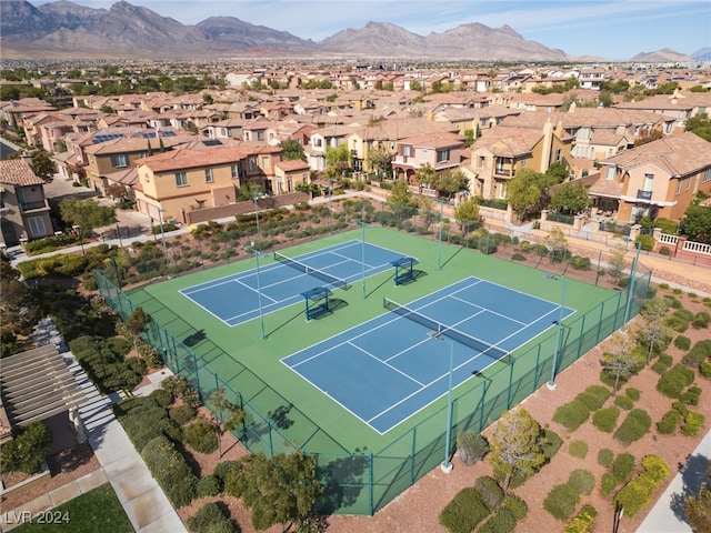 view of tennis court with a mountain view