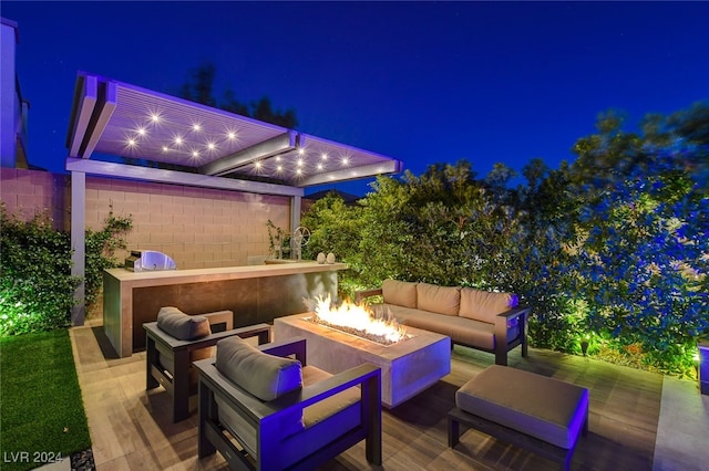 patio at night with an outdoor living space