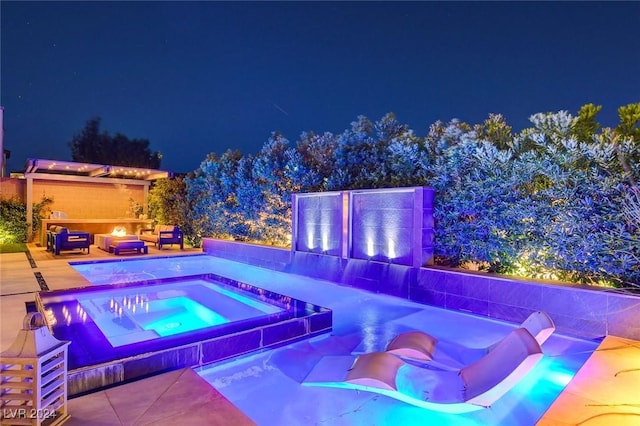 2567 Speyburn Ave, Henderson, NV 89044 - pool at twilight featuring an in-ground hot tub and outdoor lounge area