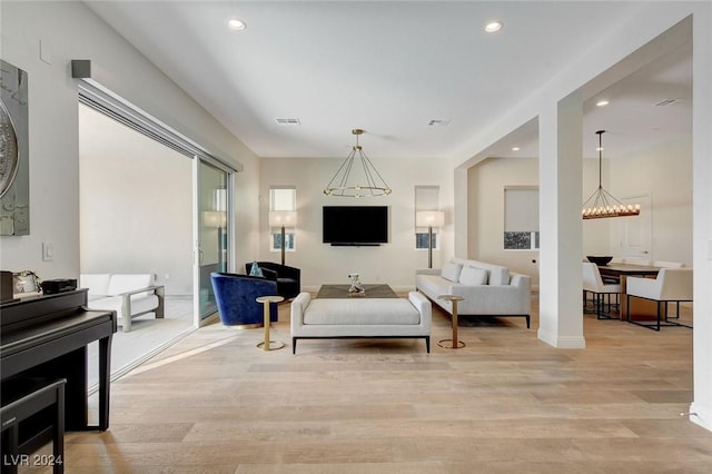 2567 Speyburn Ave, Henderson, NV 89044 - living area with light wood finished floors, recessed lighting, a chandelier, and baseboards