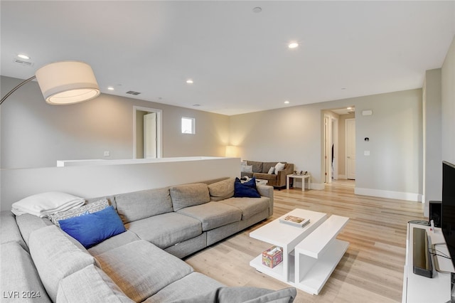 living room with light hardwood / wood-style flooring