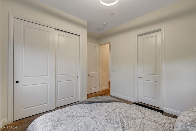 bedroom featuring a closet and hardwood / wood-style flooring