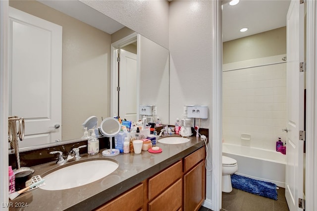 full bathroom featuring toilet, tile patterned flooring, vanity, and tub / shower combination