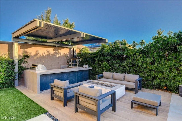 2567 Speyburn Ave, Henderson, NV 89044 - view of patio featuring an outdoor living space with a fire pit and exterior kitchen
