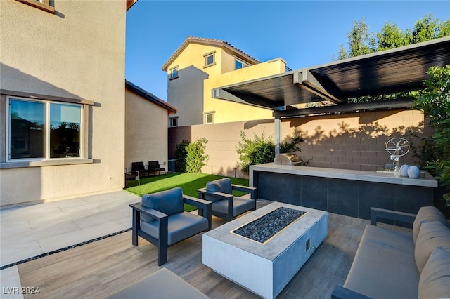 view of patio featuring an outdoor living space with a fire pit and a grill