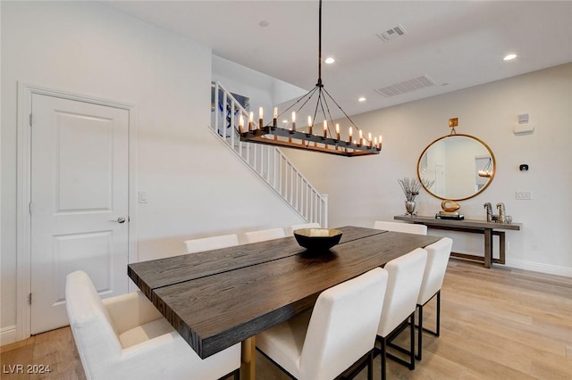 2567 Speyburn Ave, Henderson, NV 89044 - dining space featuring stairs, light wood-type flooring, a chandelier, baseboards, and recessed lighting