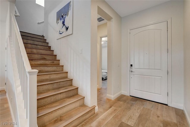 2567 Speyburn Ave, Henderson, NV 89044 - foyer with light wood-style floors, stairway, and baseboards